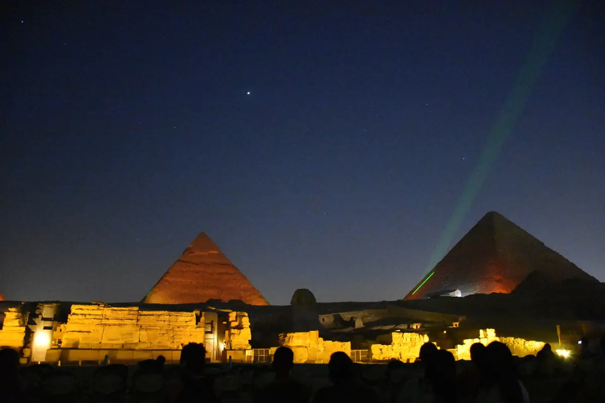 The pyramids lit up during the evening show